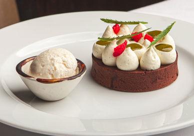 An image of a dessert on a plate, Three-course menu and champagne cocktail. Benares Restaurant and Bar