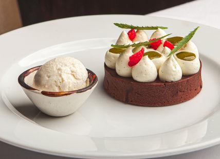An image of a dessert on a plate, Three-course menu and champagne cocktail. Benares Restaurant and Bar
