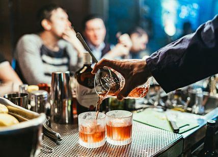 An image of a person pouring a drink, Ultra-Premium Rum Tasting. Black Parrot