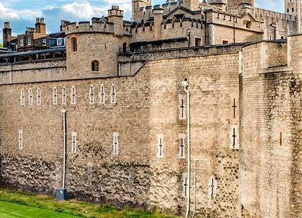 An image of a castle with a green lawn, Private Tour of Tower of London. Blue Badge Guide - Emily Baker