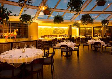 An image of a restaurant with tables and chairs, Bombay Brasserie. Bombay Brasserie