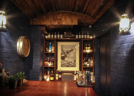 An image of a room with a bar, The Brig at Merchant House. The Brig at Merchant House