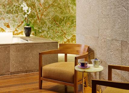 An image of a bathroom with a tub and a chair, Mind and Body Indulgence Spa Day. Bulgari Hotel London