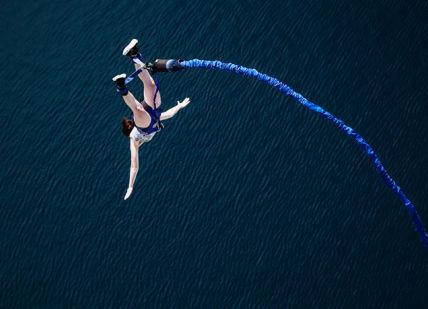 An image of a person jumping off a boat, Experience the Thrill of Canada's Highest Bungee Jump. Bungee Canada