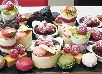 An image of a tray of desserts, Private Cupcake Masterclass and Afternoon Tea. Cake Boy