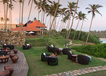 An image of a resort with palm trees, Cape Weligama Excursion. Cape Weligama
