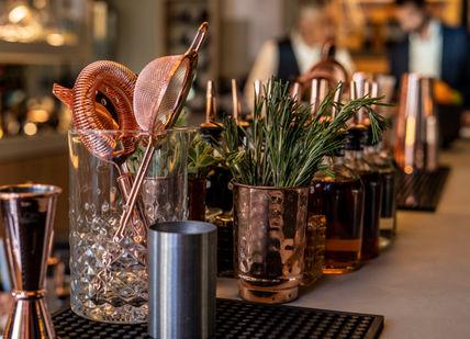 An image of a bar with a bunch of flowers, Cavo Restaurant. Cavo Restaurant