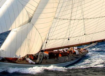 An image of a sail in the ocean, Charter the Sailing Yacht Moonbeam IV. Charter World
