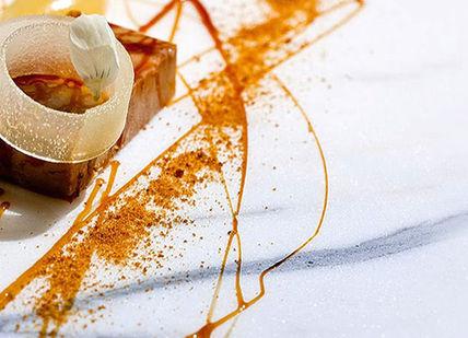 An image of a dessert with orange sauce, Intensive Professional Pastry Programme. Chef Academy London