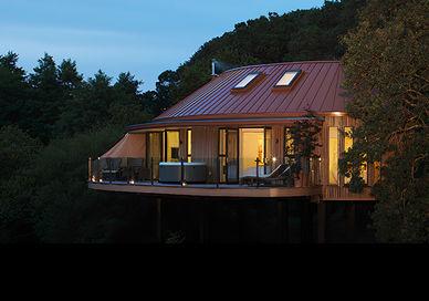 An image of a house in the woods, Two Night Stay in a Treehouse Studio Suite. Chewton Glen