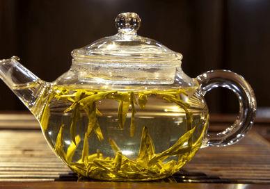 An image of a tea pot with a tea bag, Gong Fu Cha Tea Tasting. The Chinese Tea Company