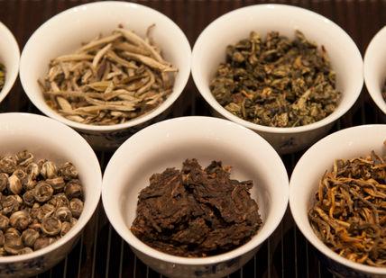 An image of a variety of herbs in small bowls, Gong Fu Tea Masterclass. The Chinese Tea Company