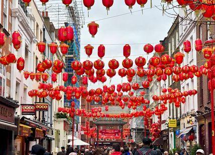 An image of a street with red lanterns, Sumptuous Soho food tour. Chubby Fellow