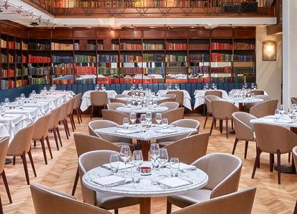 An image of a restaurant with tables and chairs, The Iconic Tasting Menu. The Cinnamon Club