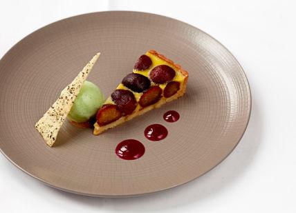 An image of a plate of food with a piece of pizza, The Iconic Tasting Menu. The Cinnamon Club