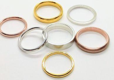 An image of a set of five different colored rings, Making Your Own Bespoke Wedding Ring. Collette Dawn