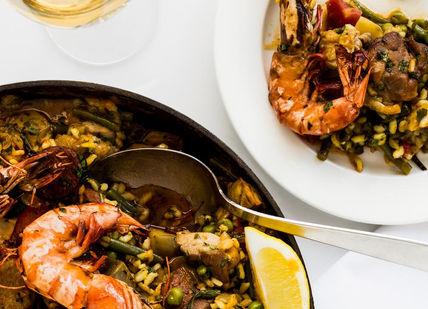 An image of a seafood dish with a glass of wine, 5-Hour Cooking Class. Cookery School at Little Portland Street
