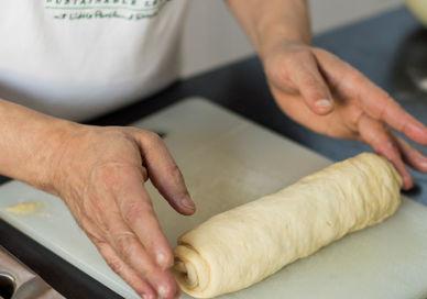 An image of a person making a pastry, Sourdough Masterclass. Cookery School at Little Portland Street