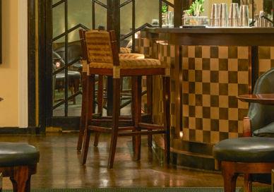 An image of a bar with chairs and a table, Daniel King. Daniel King