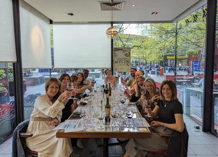 An image of a group of people at a restaurant, Davy’s Wine Tasting Class . Davy's Wine Bar
