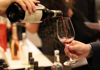 An image of a person pouring wine into a glass, Davy’s Wine Tasting Class . Davy's Wine Bar