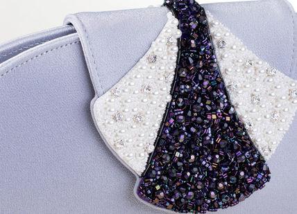 An image of a tie on a bag, Make Your Own Bespoke Leather Handbag. Deni-Deni