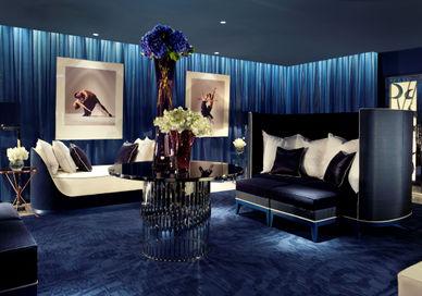 A living room with a blue carpet.