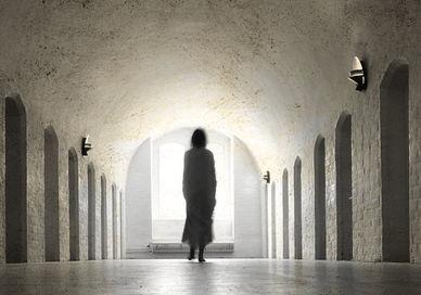 An image of a person walking through a tunnel, Ghost Tour and Stay. Dragsholm Castle