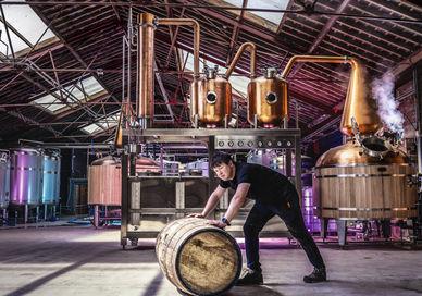 An image of a guy working in distillery