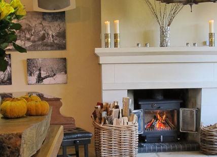 An image of a dining room with a fire place, Tasting Menu. The Dysart Petersham
