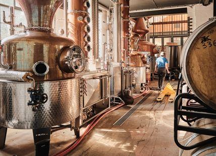 An image of a brewery with a man working, Whisky Lover’s Tour And Tasting. East London Liquor Company