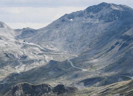 An image of a mountain range, The Klausen Pass Hire Porsche 911 Turbo Cabrio S. Edel & Stark