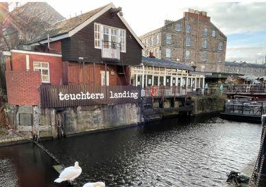 An image of a bird standing on a dock, The Foods of Leith Waterfront. Edinburgh Food Safari