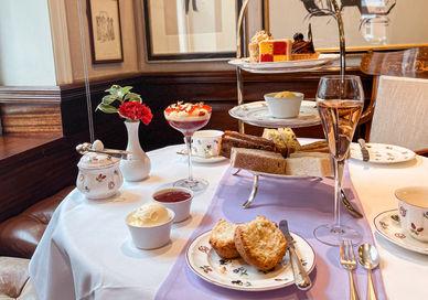 An image of a table setting with tea and desserts, Afternoon Tea. The Egerton House Hotel