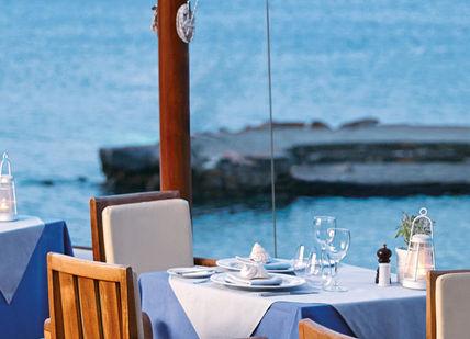 An image of a restaurant setting with a view, Five Star Greek Spa Getaway. Elounda Mare