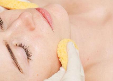 An image of a woman getting a facial massage, Face Place Signature Treatment. Face Place (London) Limited