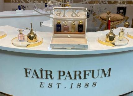 An image of a counter with a lot of perfumes, Fair Parfum. Fair Parfum