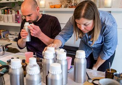 An image of a man and woman in a kitchen, Luxury Vegan Candle Making Workshop. Fais HQ