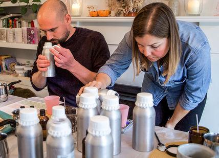 An image of a man and woman in a kitchen, Luxury Vegan Candle Making Workshop. Fais HQ