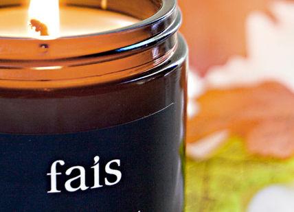 An image of a candle with a fall leaf, Luxury Vegan Candle Making Workshop. Fais HQ