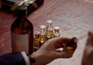 An image of a man taking a drink, Customise Your Own Fragrances. Floris