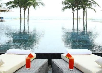 An image of a pool with lounge chairs, Exotic Four-Night Spa Break. Fusion Resorts