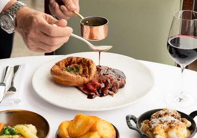 An image of a person eating food,  3 course Sunday Lunch. Galvin at Windows