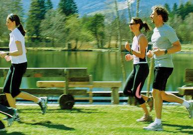 An image of two people running in the park, Couples' Seven-Night Mayr Health Retreat. Gesundheitszentrum Igls GmbH (Parkhotel Igls)