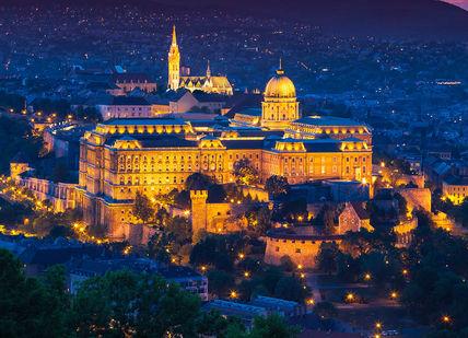 An image of a city at night, 1-night stay in 5-Star hotel in Budapest.