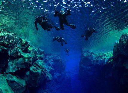 An image of a group of divers swimming in a cave, 3 Night Stay at a hotel.