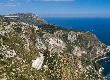 An image of a cliff overlooking the ocean, Bentley Roadtrip on the French Riviera. Getaway-Pseudo-Supplier