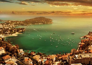 An image of a sunset over the city of rio, Bentley Roadtrip on the French Riviera.