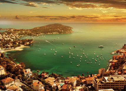 An image of a sunset over the city of rio, Bentley Roadtrip on the French Riviera.