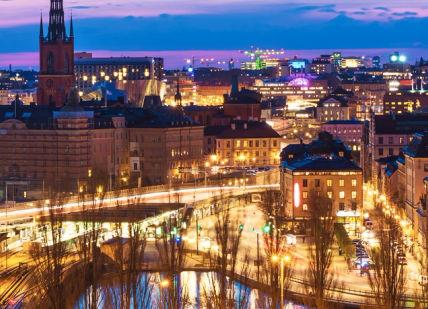 An image of a city at night, Dinner at a Michelin star restaurant in Stockholm.